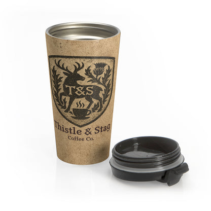 Travel mug with Thistle & Stag Coffee Co. logo on a white background